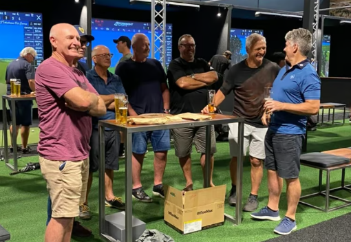 Men playing indoor golf